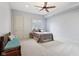 Bedroom with a wood bench and a comfortable-looking bed at 16332 Valhalla Dr, Noblesville, IN 46060