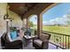 Relaxing covered patio with a golf course view, ceiling fans, and outdoor furniture at 16332 Valhalla Dr, Noblesville, IN 46060