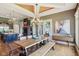 Open concept dining area with hardwood floors, designer lighting, and seamless transition to kitchen at 16332 Valhalla Dr, Noblesville, IN 46060