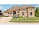 Stunning stone and brick home featuring manicured lawn, mature landscaping, and a charming covered entryway at 16332 Valhalla Dr, Noblesville, IN 46060
