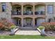 The back of the house features a brick facade, multiple balconies and well maintained landscaping at 16332 Valhalla Dr, Noblesville, IN 46060