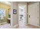 Hallway view into the laundry room and office space with custom cabinets at 16332 Valhalla Dr, Noblesville, IN 46060