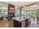 Gourmet kitchen island with stainless steel appliances, and view into dining area and living room at 16332 Valhalla Dr, Noblesville, IN 46060