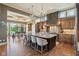 Gourmet kitchen featuring granite countertops, stone backsplash, premium appliances, and large center island at 16332 Valhalla Dr, Noblesville, IN 46060