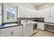 Bright laundry room with white cabinetry, countertop space, and modern washer and dryer at 16332 Valhalla Dr, Noblesville, IN 46060