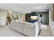 Spacious living room with a large sectional sofa and stairway at 16332 Valhalla Dr, Noblesville, IN 46060