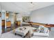 Basement recreation room with a wet bar, shuffleboard, and sitting area at 16332 Valhalla Dr, Noblesville, IN 46060