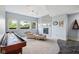 Basement recreation room with a fireplace, shuffleboard, and sitting area at 16332 Valhalla Dr, Noblesville, IN 46060