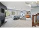 Open floor plan living room with access to an outside patio and kitchen/bar area at 16332 Valhalla Dr, Noblesville, IN 46060