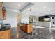 Open floor plan living room with a wet bar, stairs, and large sectional sofa at 16332 Valhalla Dr, Noblesville, IN 46060