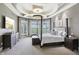 Spacious main bedroom features trey ceiling, large windows with views, and neutral decor at 16332 Valhalla Dr, Noblesville, IN 46060