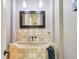 Chic powder room features decorative tiling, stone sink, and modern faucet at 16332 Valhalla Dr, Noblesville, IN 46060