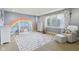 Playful room has a whimsical design, large windows, and neutral carpet at 16332 Valhalla Dr, Noblesville, IN 46060
