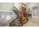 Elegant staircase with wrought iron railings and decorative carpet runner at 16332 Valhalla Dr, Noblesville, IN 46060