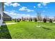 Lush green backyard with a concrete patio, perfect for relaxing or entertaining at 1704 Beach St, Greenwood, IN 46143