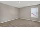 Neutral bedroom with carpet flooring and a window offering natural light at 1704 Beach St, Greenwood, IN 46143