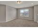 Neutral bedroom with carpet, one window and light gray walls at 1704 Beach St, Greenwood, IN 46143