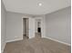 Bedroom features neutral walls, carpet, and closet and bathroom doorways at 1704 Beach St, Greenwood, IN 46143