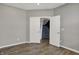 This bedroom features hardwood flooring and access to the staircase at 1704 Beach St, Greenwood, IN 46143