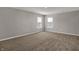 Spacious bedroom with neutral carpet, two windows with blinds, and ample natural light at 1704 Beach St, Greenwood, IN 46143