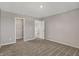 Neutral bedroom featuring carpet flooring, gray walls, and a walk-in closet and attached bathroom at 1704 Beach St, Greenwood, IN 46143