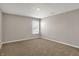 Cozy bedroom features plush carpeting and natural light at 1704 Beach St, Greenwood, IN 46143