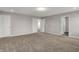 Spacious carpeted bedroom with open doors offering easy access at 1704 Beach St, Greenwood, IN 46143