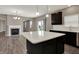 Modern kitchen and living area with open floor plan, white countertops, and stainless steel appliances at 1704 Beach St, Greenwood, IN 46143