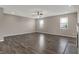 Large living room area with ceiling fan, recessed lights, and two windows at 1704 Beach St, Greenwood, IN 46143