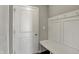 Mudroom with built-in bench, coat hooks, and nearby door at 1704 Beach St, Greenwood, IN 46143