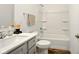 Bathroom featuring a white tub shower, gray vanity with a white countertop, and modern fixtures at 19257 Red Willow Ln, Noblesville, IN 46062