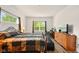 Bedroom featuring a large window, neutral walls, and a wood dresser at 19257 Red Willow Ln, Noblesville, IN 46062