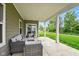 Covered patio with wicker furniture perfect for outdoor relaxation and enjoying the landscaped yard at 19257 Red Willow Ln, Noblesville, IN 46062
