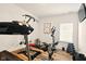 Exercise room showcasing several exercise machines, free weights, and wood-look flooring at 19257 Red Willow Ln, Noblesville, IN 46062