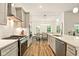 Bright, open-concept kitchen with modern appliances, spacious countertops, and seamless flow to the dining area at 19257 Red Willow Ln, Noblesville, IN 46062