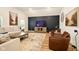 Cozy living room features modern decor, a vaulted ceiling, and a dark accent wall at 19257 Red Willow Ln, Noblesville, IN 46062