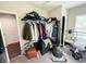 Bedroom with clothing rack, boxing bag, barbells, dumbbell, carpet, and white ceiling at 201 N Tacoma Ave, Indianapolis, IN 46201