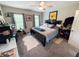 Cozy bedroom featuring carpeted floors, ceiling fan, and windows that provide natural light at 201 N Tacoma Ave, Indianapolis, IN 46201