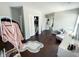 Open bedroom featuring a wardrobe and a vanity with natural light from the window at 201 N Tacoma Ave, Indianapolis, IN 46201