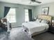 Inviting bedroom with neutral tones, a plush bed, and ample natural light from the windows at 201 N Tacoma Ave, Indianapolis, IN 46201