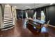 Stylish dining room features a rustic wooden table, bench seating, and chic dark gray walls at 201 N Tacoma Ave, Indianapolis, IN 46201