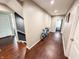 Bright hallway with wood floors leads to various rooms, showcasing the home's functional layout at 201 N Tacoma Ave, Indianapolis, IN 46201