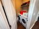 Laundry room with washer and dryer, shelving, laundry basket, and white door at 201 N Tacoma Ave, Indianapolis, IN 46201