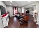 Inviting living room features a comfortable brown sectional, fireplace, and hardwood floors at 201 N Tacoma Ave, Indianapolis, IN 46201