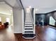 Open-concept home featuring a staircase with white risers and dark stained wood steps that add visual interest at 201 N Tacoma Ave, Indianapolis, IN 46201