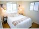 Bright bedroom with large windows, white linens, and a pair of bedside tables with lamps at 21 Roderick Ct, Beech Grove, IN 46107