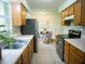 Functional kitchen with stainless steel appliances, wood cabinets, and adjacent dining area at 21 Roderick Ct, Beech Grove, IN 46107