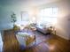 Tastefully decorated living room with a neutral color palette and comfortable furnishings at 21 Roderick Ct, Beech Grove, IN 46107
