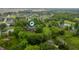 Aerial view of sprawling estate, set amongst lush trees and ponds, with beautiful landscaping at 2411 N County Road 500 W, Muncie, IN 47304