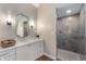 Well-lit bathroom featuring a large mirror, modern fixtures, and a walk-in shower at 2411 N County Road 500 W, Muncie, IN 47304
